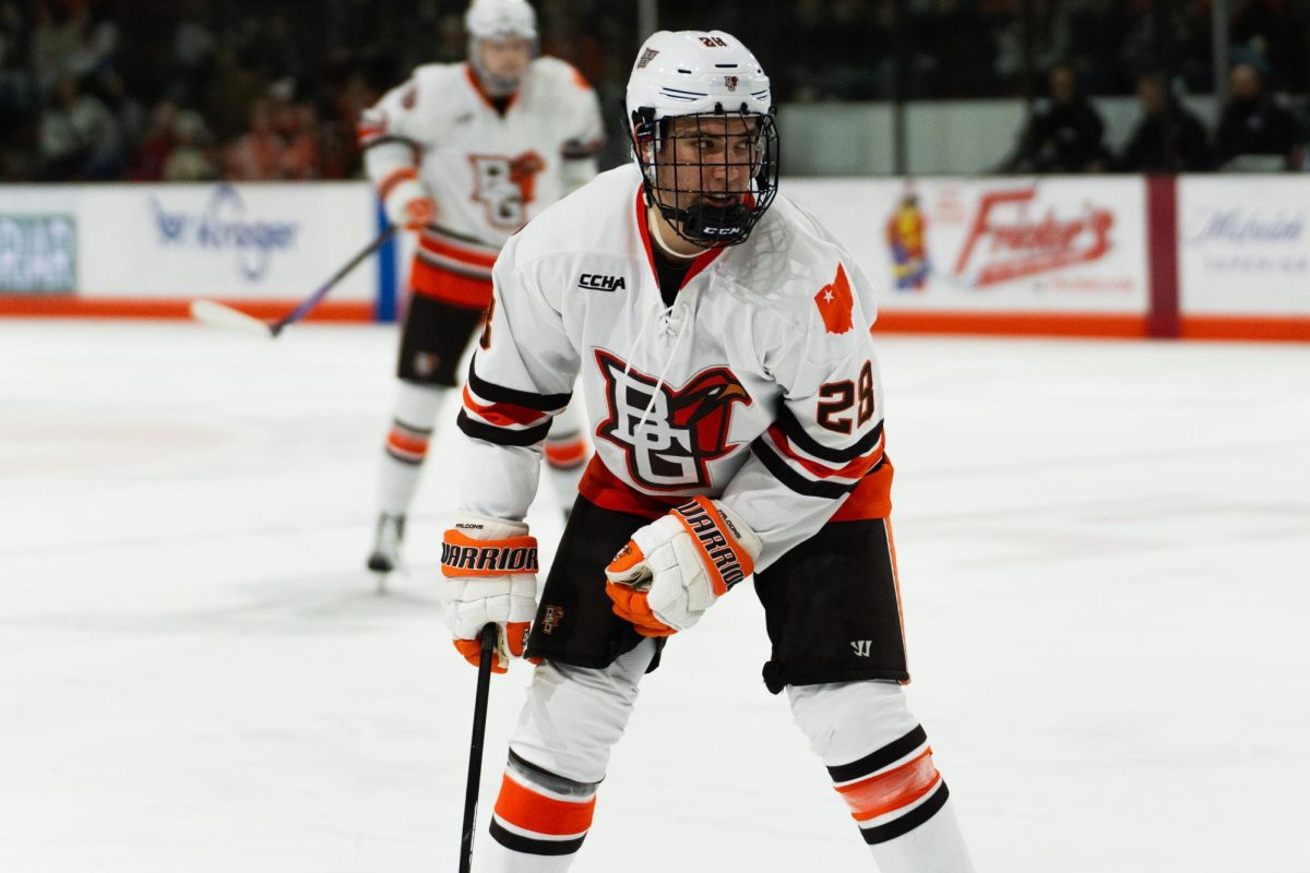 Bowling Green, OH- Falcons junior forward Jaden Grant (28) pulling back to stop the Viking advance at the Slater Family Ice Arena in Bowling Green, Ohio.