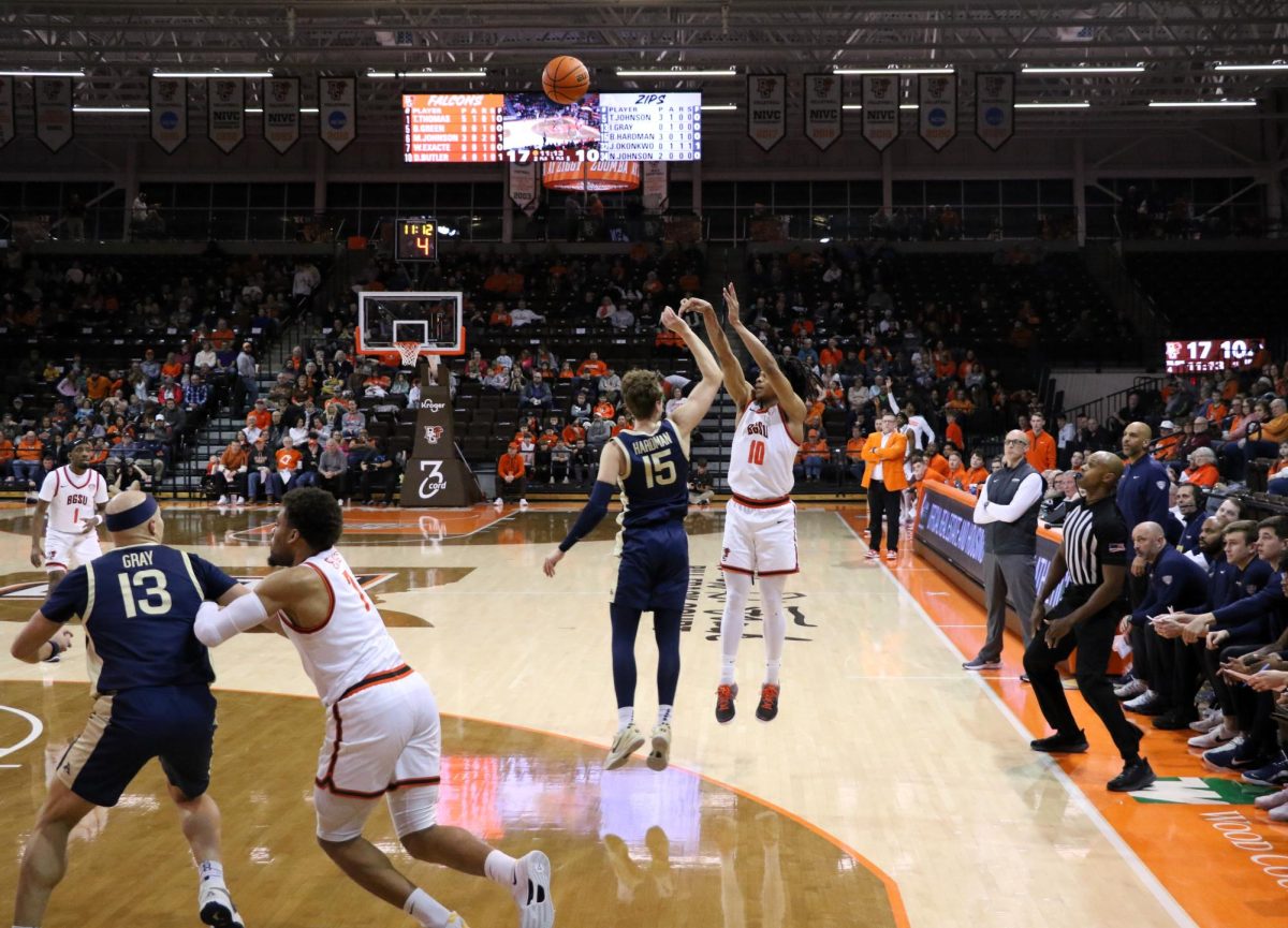 Bowling Green, Ohio- Falcons Senior Guard Derrick Butler (10) shoots a three to keep the Falcons lead against the Zips.