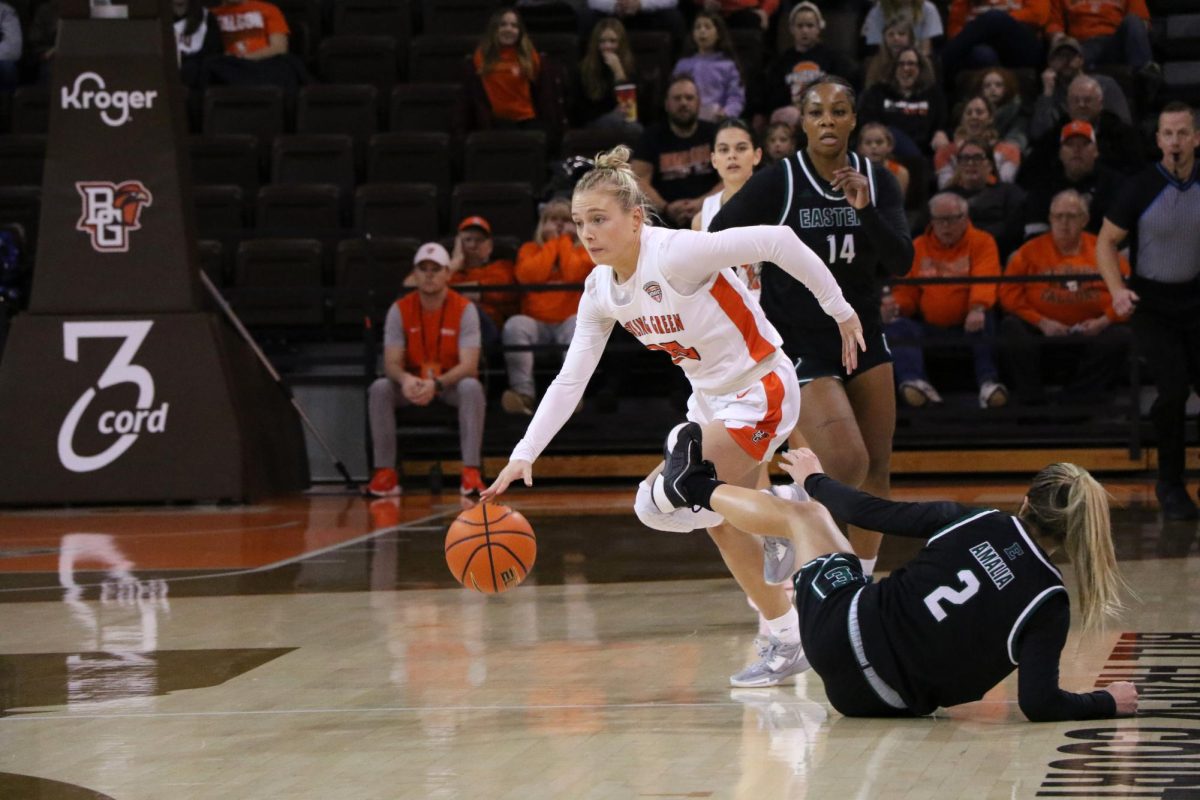 Bowling Green, OH - Falcons fifth year guard Lexi Fleming (25) driving past the Easter Michigan defense at the Stroh Center in Bowling Green, Ohio.