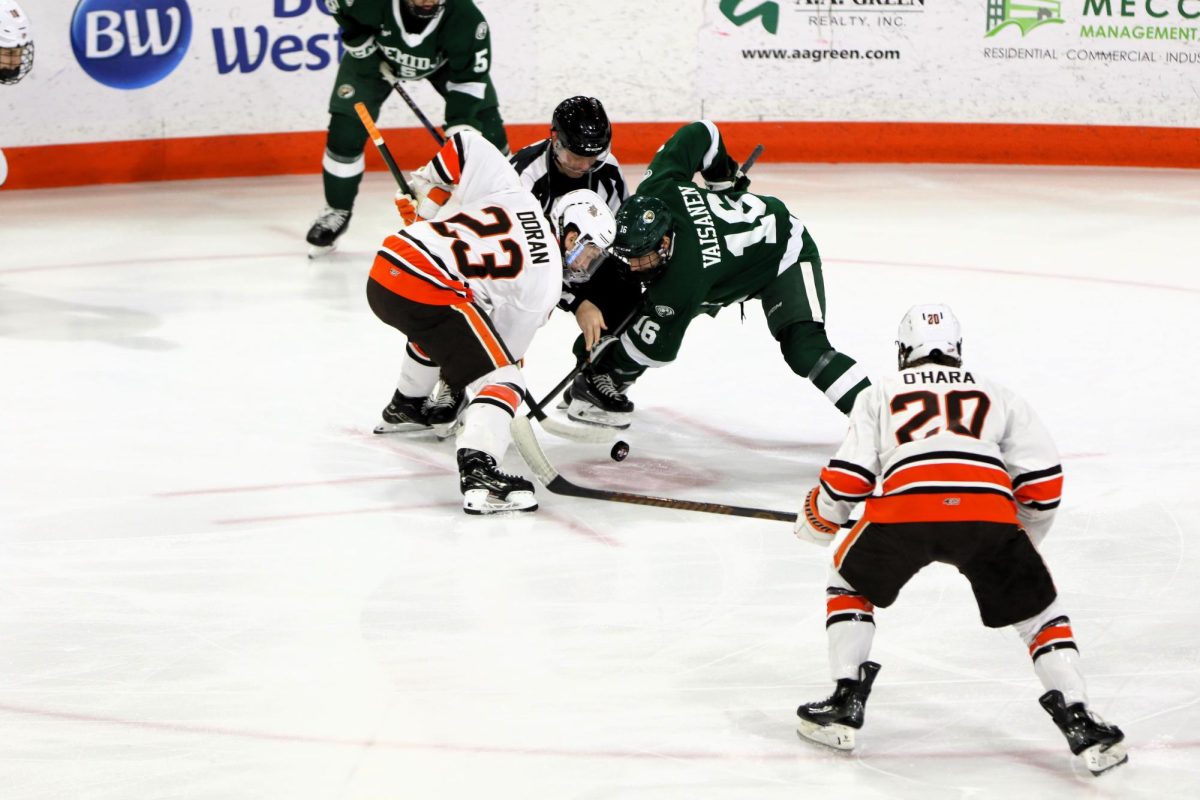 Bowling Green, Ohio- Falcons Sophomore Forward Ben Doran (23) goes head to head for the face off against Bemidji.