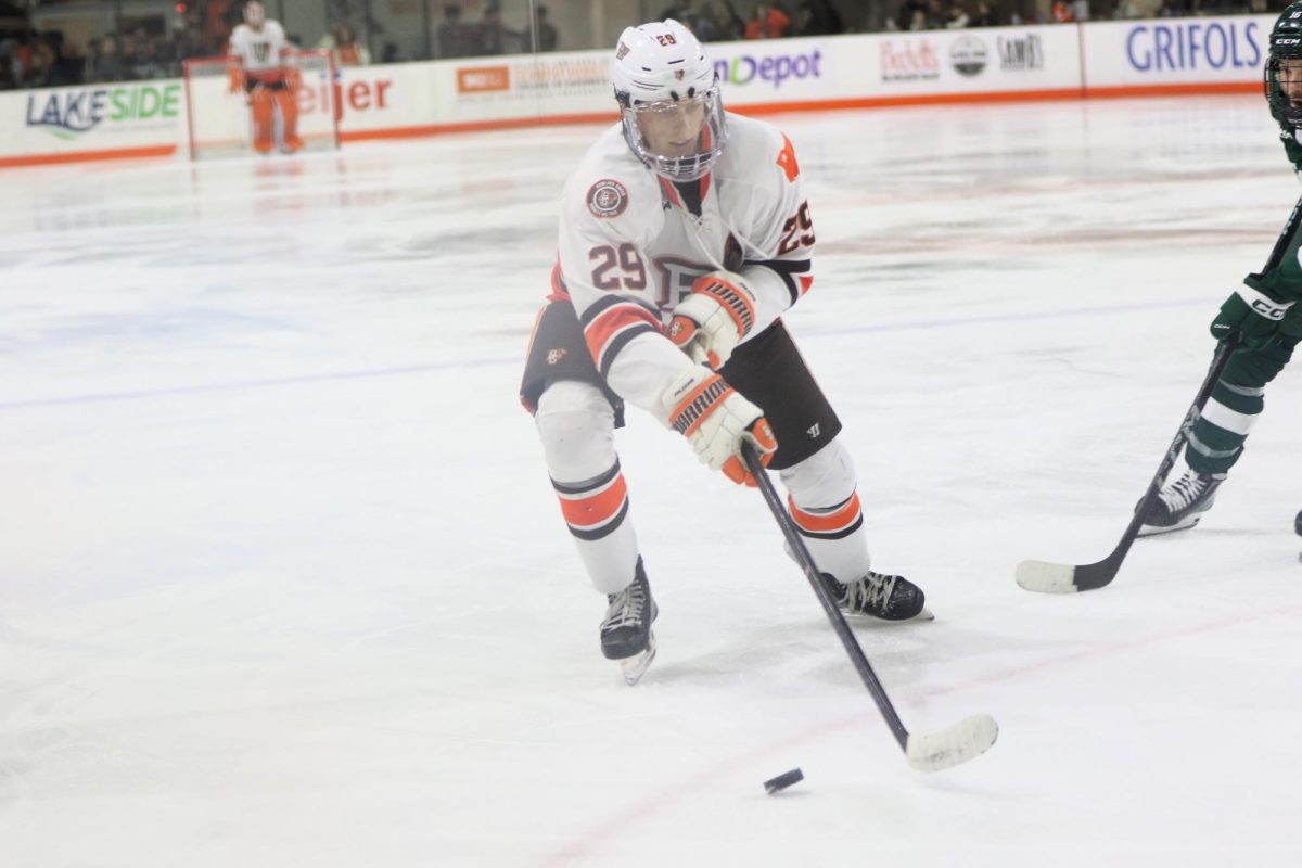 Bowling Green, Ohio- Falcons Sophomore Forward Brody Waters (29) moves his way up the ice with the puck to try and push the falcons lead farther.