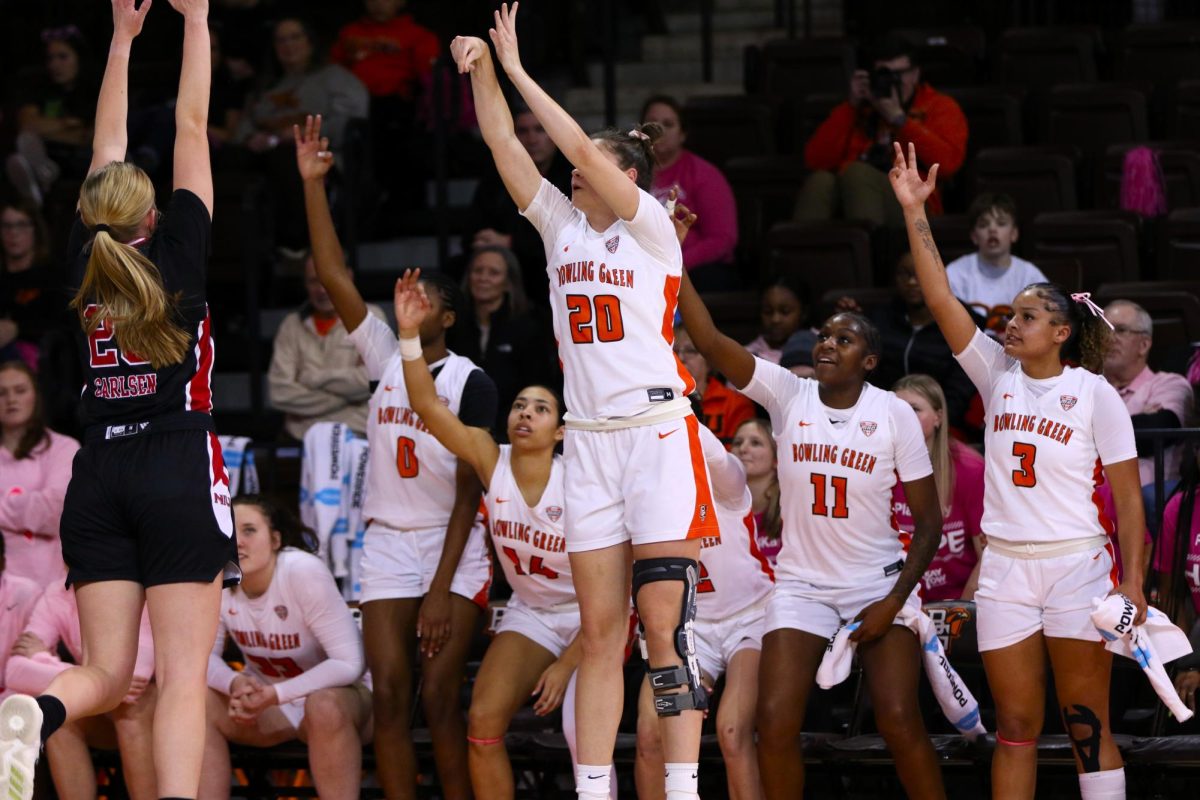 Bowling Green, Ohio- Falcons Redshirt-Sophomore Jasmine Fearne (20) shoots for three in front of the Falcons bench.