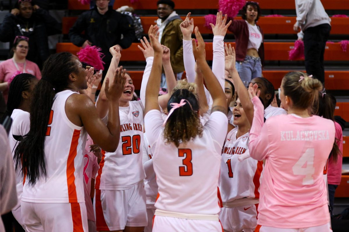 Bowling Green, Ohio- The Falcons celebrate around Lexi Fleming (25) after scoring one thousand points in her career in their win against Northern Illinois at the Stroh Center.