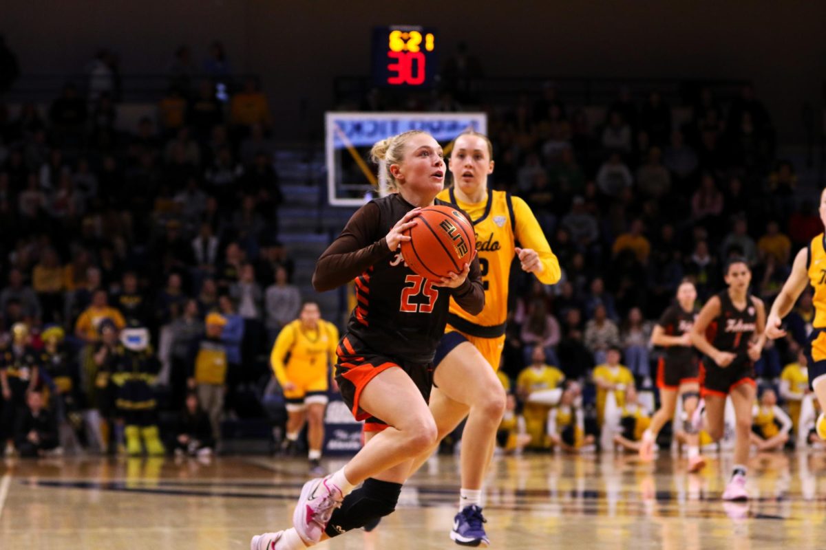 Toledo, Ohio- Falcons Fifth Year Guard Lexi Fleming (25) steals the ball and runs up for a nice layup.