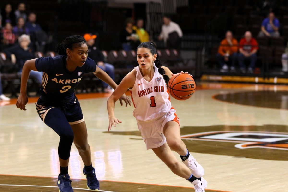 Bowling Green, Ohio- Falcons Senior Guard Amy Velasco (1) pushes her way to the paint to try and get an easy layup over the Zips defense.