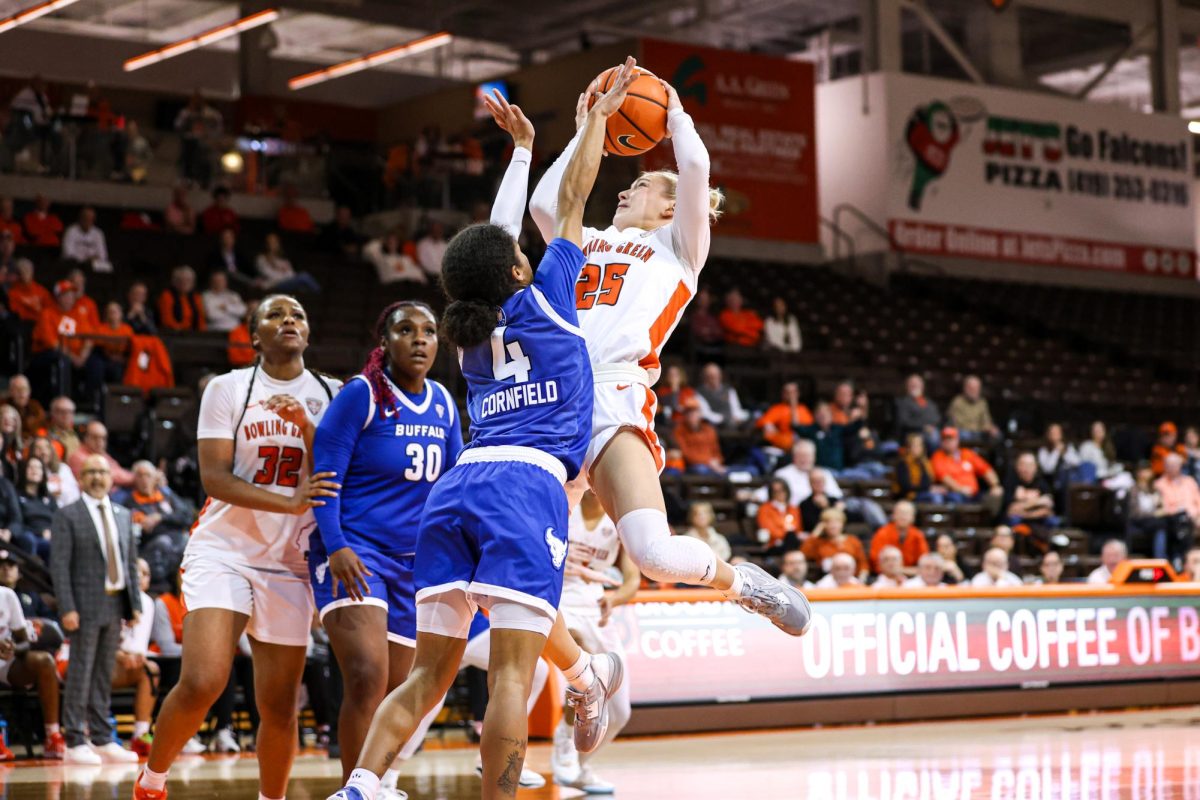 Bowling Green, OH - Falcons fifth year guard Lexi Fleming (25) attempts a shot against the Buffalo Bulls at the Stroh Center in Bowling Green, Ohio.