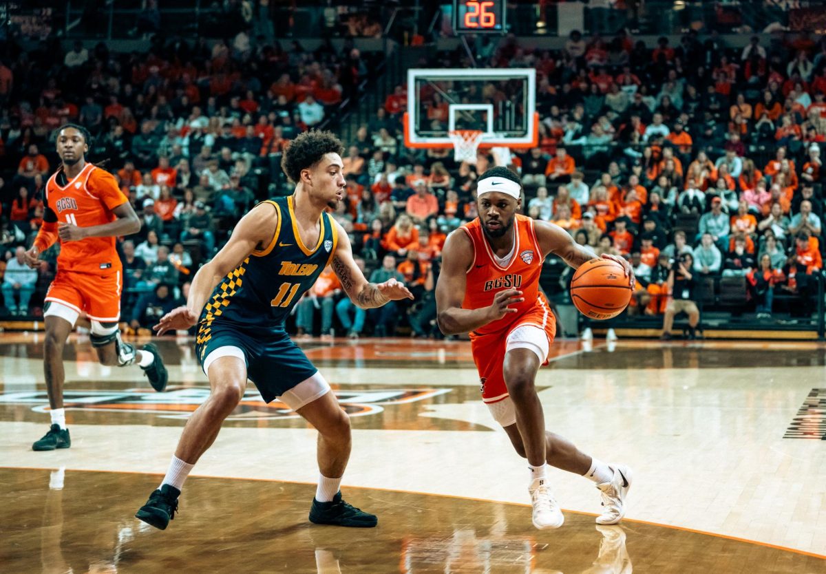 Bowling Green, OH – Falcons Senior Guard DaJion Humphrey (3) takes on a Rocket defender at the Stroh Center in Bowling Green, Ohio