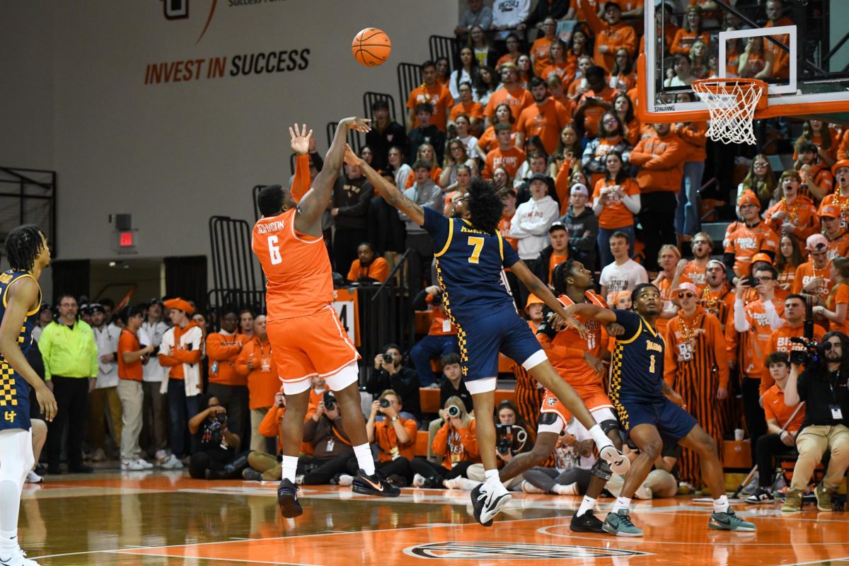 Bowling Green, OH - Falcons senior forward Marcus Johnson (6) going up over the Rockets defense at the Stroh Center in Bowling Green, Ohio.