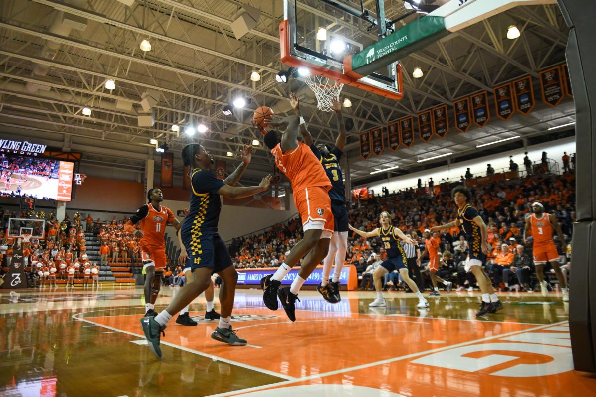 Bowling Green, OH - Falcons senior forward Marcus Johnson (6) going up strong in the paint at the Stroh Center in Bowling Green, Ohio.