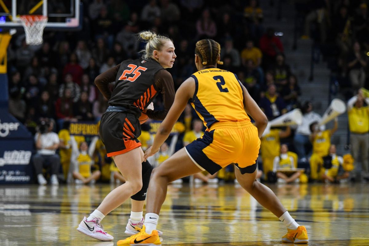 Toledo, OH - Falcons fifth year guard Lexi Fleming (25) waiting for the play to develop at Savage Arena in Toledo, Ohio.