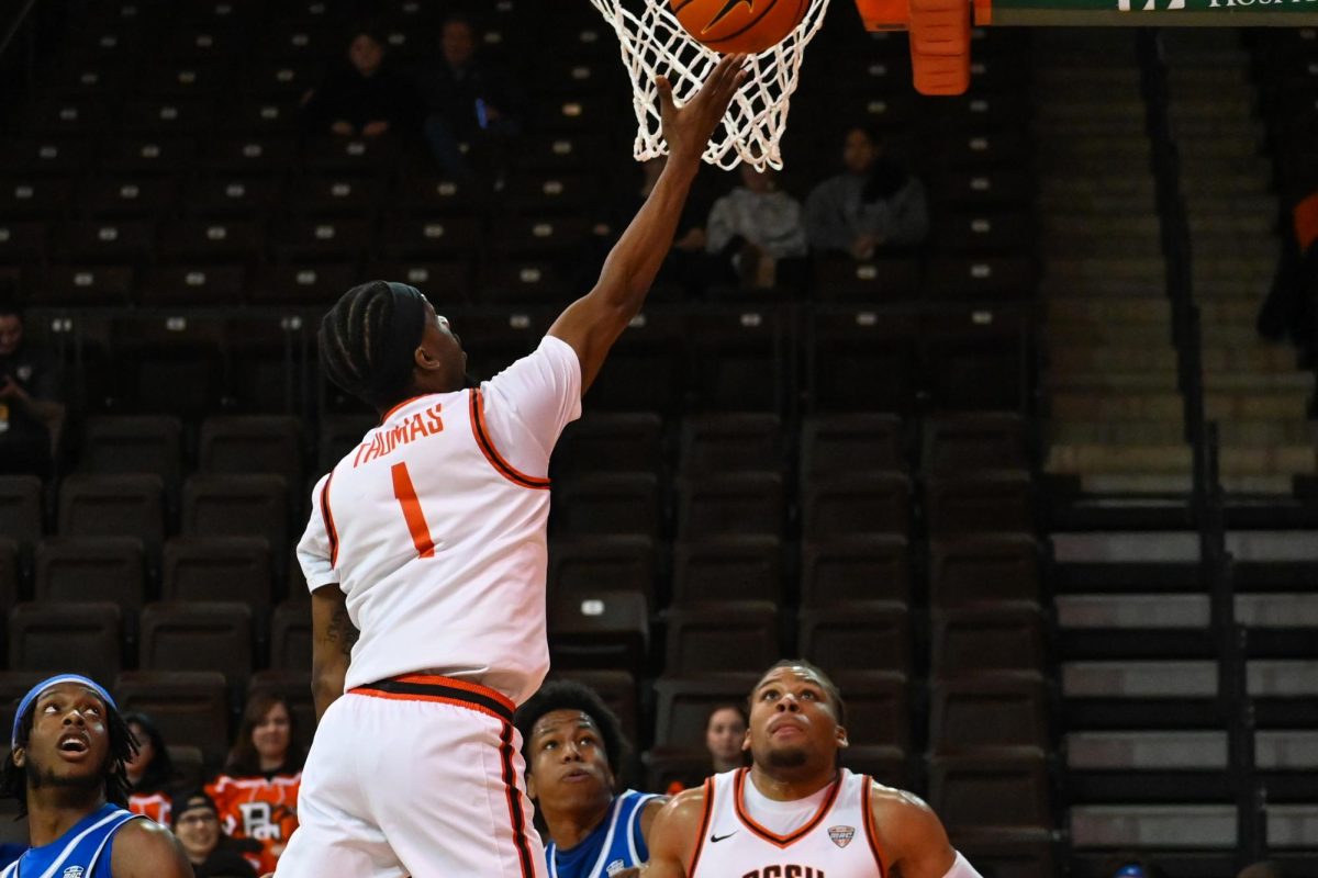 Bowling Green, OH - BGSU senior guard Trey Thomas (1) scores his 1000th career point against Buffalo inBowling Green, Ohio.