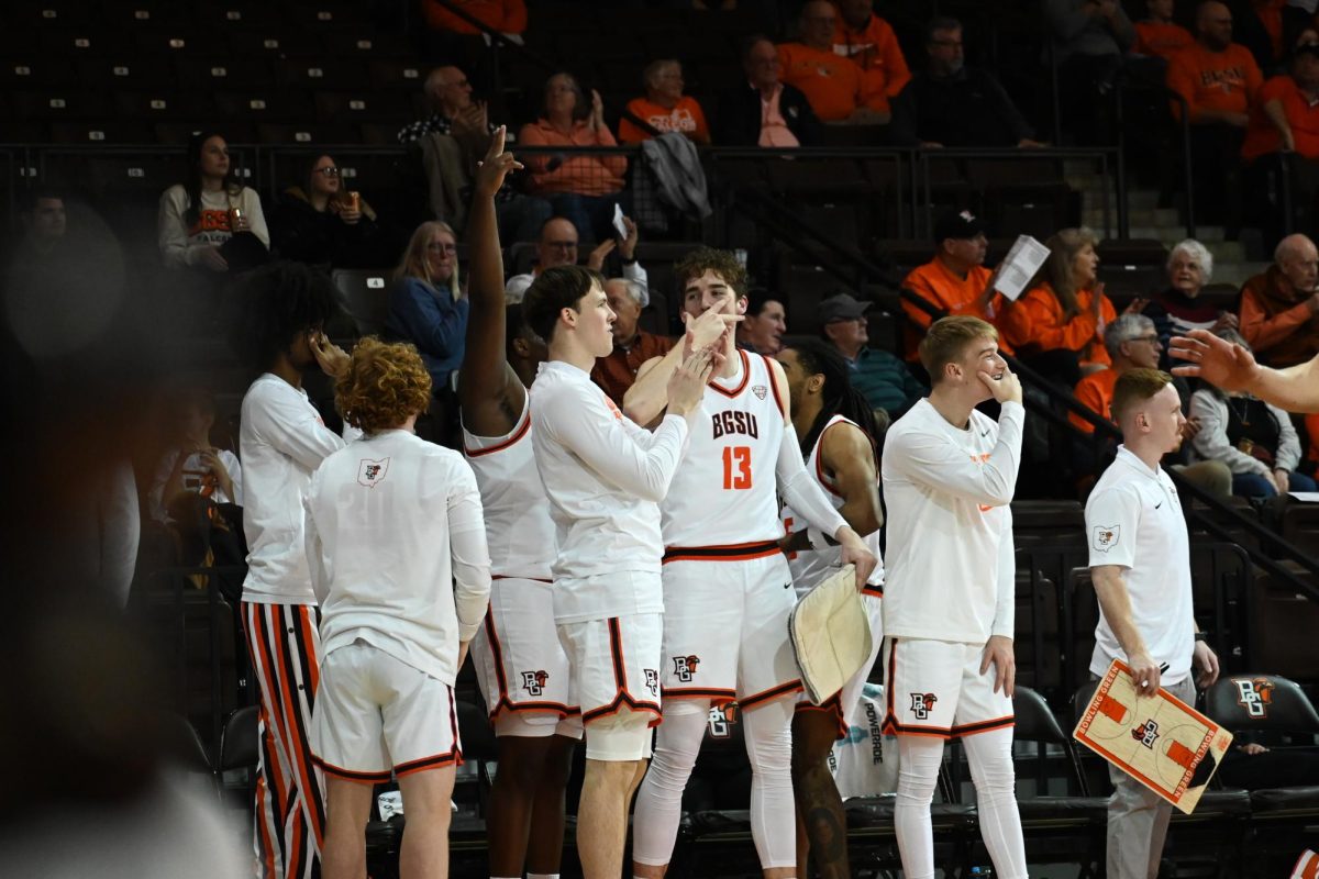 Bowling Green, OH - The BGSU Men's Basketball team celebrates the make of a three-pointer in Bowling Green, Ohio.