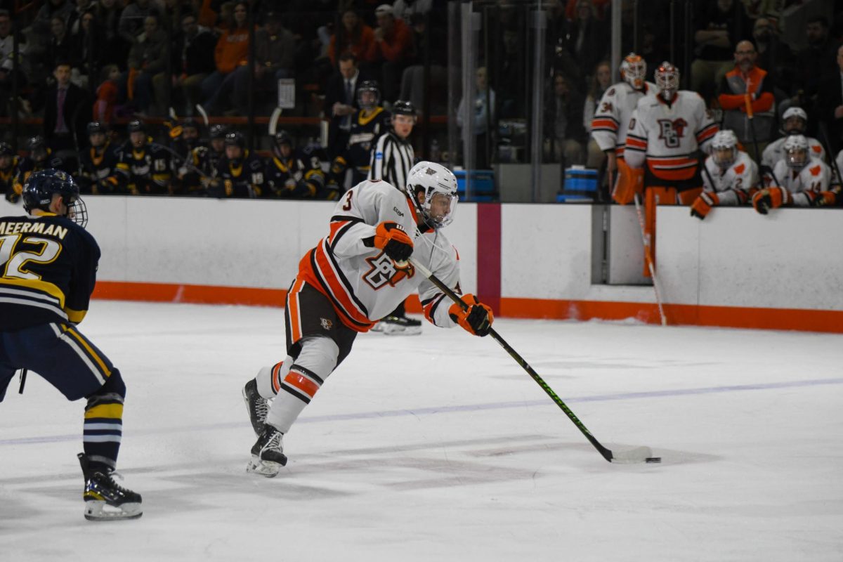 Bowling Green, OH - Falcons freshman defender Ivan Korodiuk (3) taking a shot on goal at Slater Family Ice Arena in Bowling Green, Ohio.