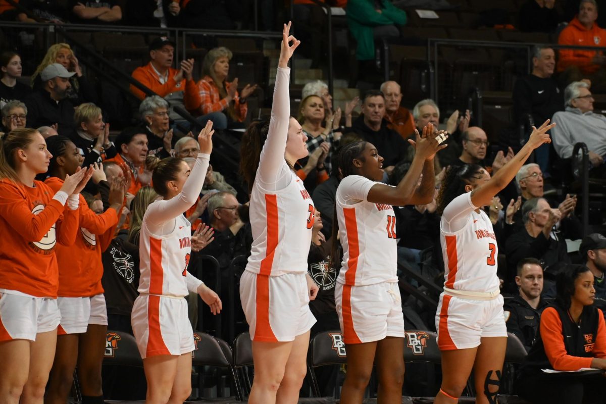 Bowling Green, OH - BGSU team celebrates after their teammate makes a three-pointer in Bowling Green, Ohio.