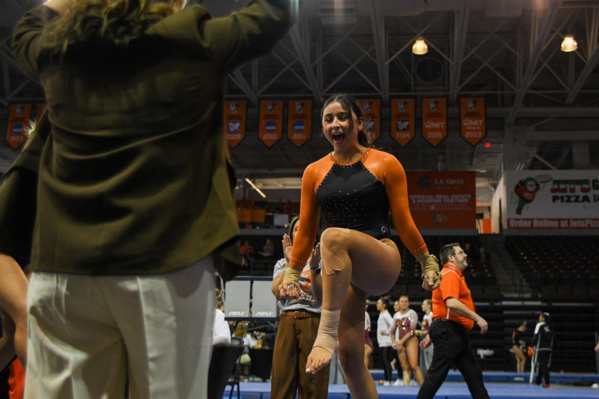 Bowling Green, OH - Falcons senior Katrina Mendez Abolnik celebrating her  vault performance at the Stroh Center in Bowling Green, Ohio.