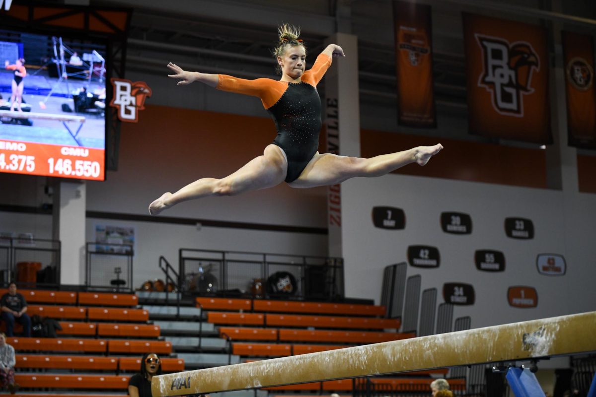 Bowling Green, OH - Falcons junior Megan Bingham performing her uneven beam routine at the Stroh Center in Bowling Green, Ohio.