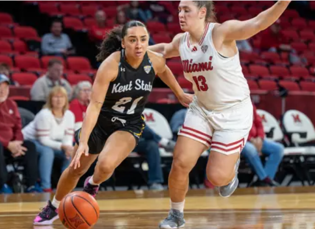 Junior guard Dionna Gray driving to the basket against Miami 