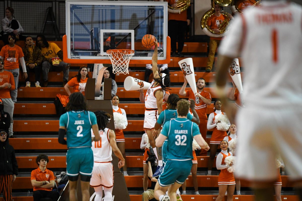 Bowling Green, OH - Falcons sophomore guard Braelon Green (5) throwing down a dunk on a fast break at the Stroh Center in Bowling Green, Ohio.