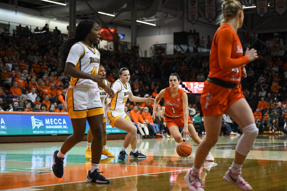 Bowling Green, OH - Falcons senior guard Amy Velasco (1) driving to the hoop at the Stroh Center in Bowling Green, Ohio.