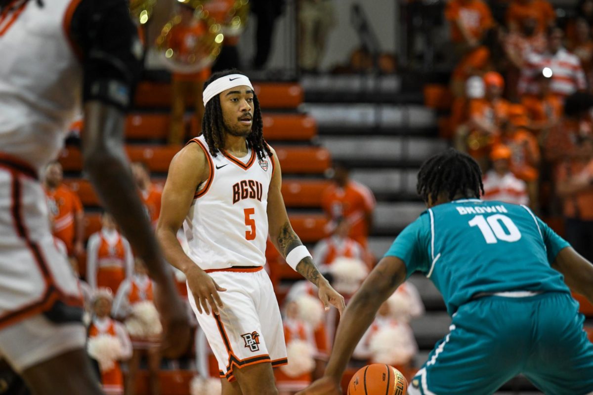 Bowling Green, OH - Falcons sophomore guard Braelon Green (5) bringing up the ball at the Stroh Center in Bowling Green, Ohio.