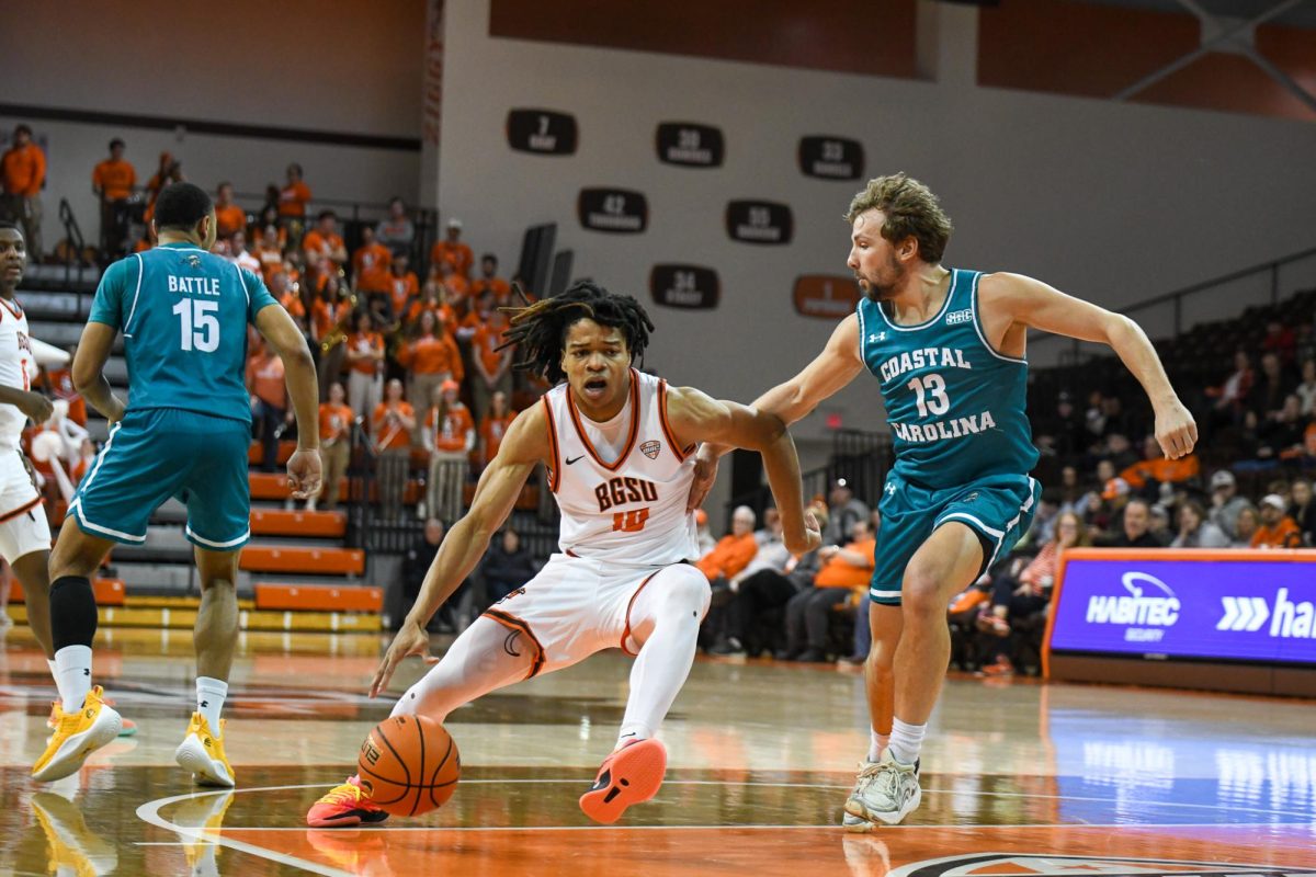 Bowling Green, OH - Falcons senior guard Derrick Butler (10) driving to the hoop at the Stroh Center in Bowling Green, Ohio.