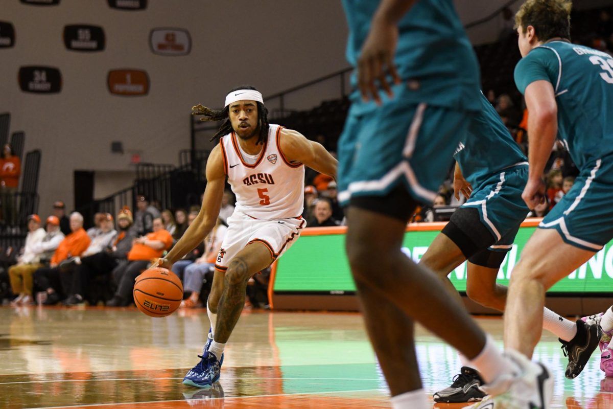 Bowling Green, OH - Falcons sophomore guard Braelon Green (5) driving around the Chanticleers defense at the Stroh Center in Bowling Green, Ohio.