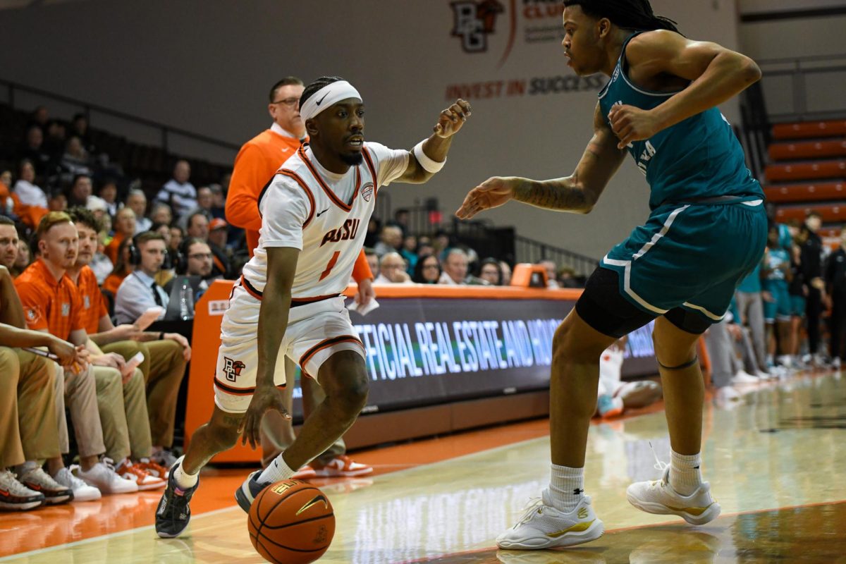 Bowling Green, OH - Falcons senior guard Trey Thomas (1) getting out of the corner and around the Chanticleers defense at the Stroh Center in Bowling Green, Ohio.