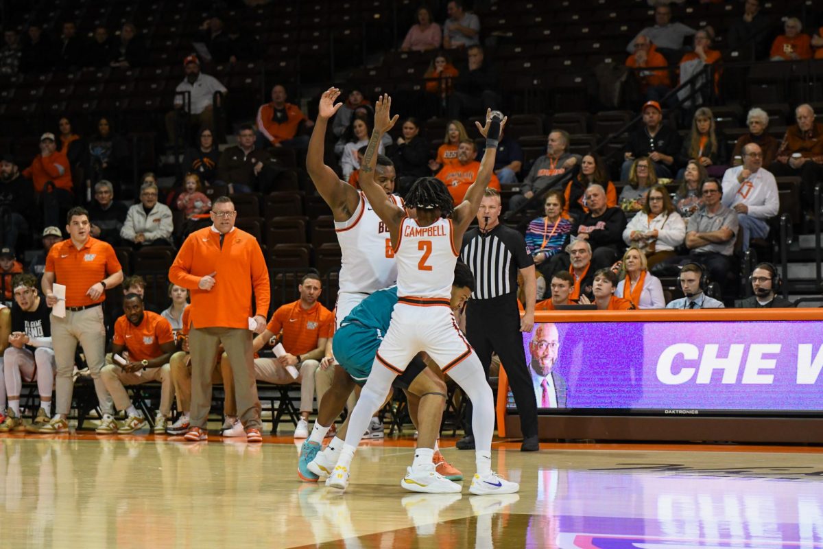 Bowling Green, OH - Falcons senior forward Marcus Johnson (6) and junior guard Javontae Campbell (2) locking down the Chanticleers at the Stroh Center in Bowling Green, Ohio.