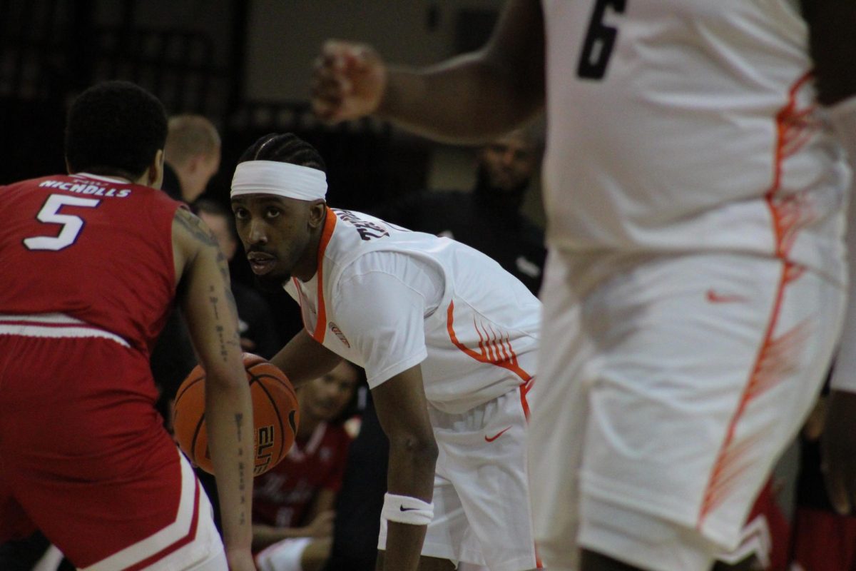 Bowling Green, OH - Falcons senior guard Trey Thomas (1) looking for the play to develop at the Stroh Center in Bowling Green, Ohio.