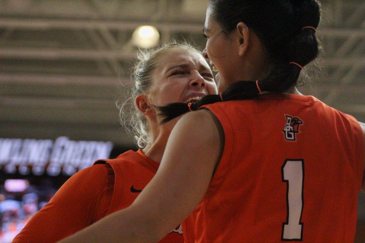 Bowling Green, OH - Falcons senior guard Amy Velasco (1) and fifth year guard Lexi Fleming (25) celebrate after a successful play against the Rockets at the Stroh Center in Bowling Green, Ohio.