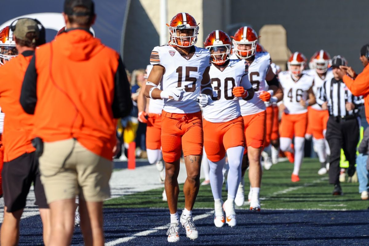 Massillon Washington graduate Dorian Pringle (30) trots out onto the field with his teammates prior to kickoff against the Toledo Rockets on Oct. 26, 2024.