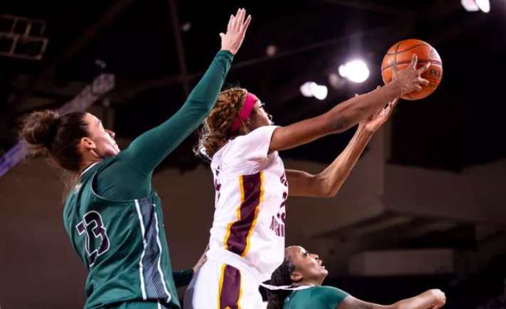 Central Michigan freshman forward Ayanna-Sarai Darrington shooting a layup over Ohio defenders

