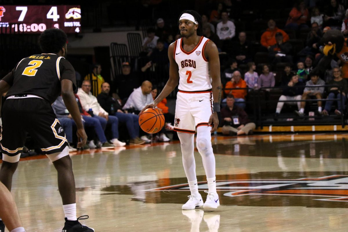 Bowling Green, Ohio- Falcons Junior Guard Javontae Campbell (2) scans the court to find a scoring opportunity at the Stroh Center in Bowling Green, Ohio.