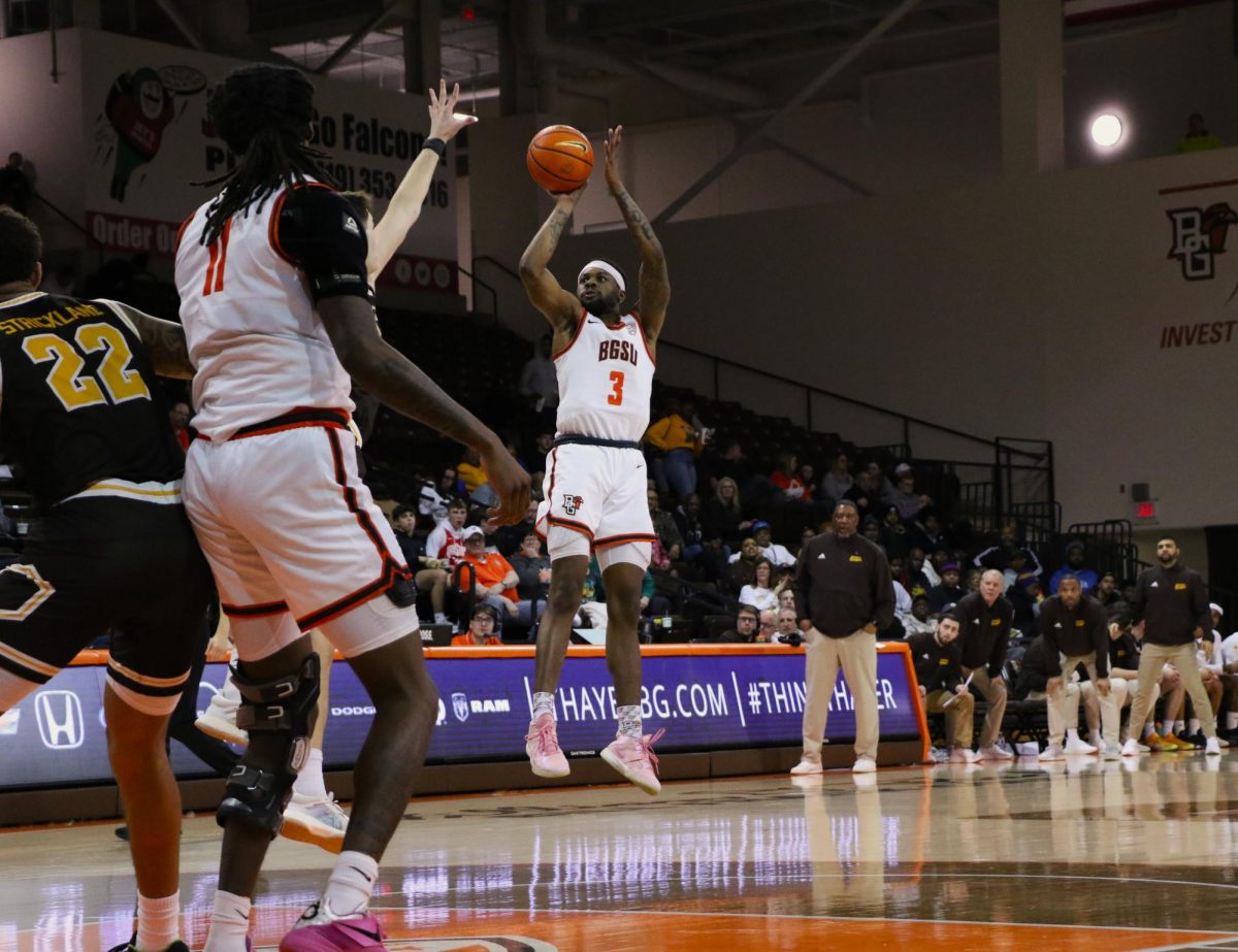 Bowling Green, Ohio- Falcons Senior Guard DaJion Humphrey (3) shoots a wide-open midrange shot over the entire Broncos defense at the Stroh Center in Bowling Green, Ohio.