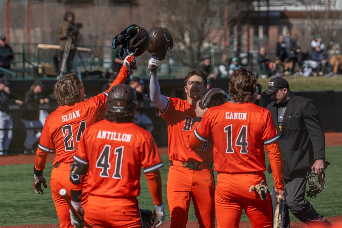 Athens, OH- Falcon teammates meet junior right fielder Zack Horky (34) at home plate after a go-ahead three run home run at Bob Wren Stadium in Athens, Ohio.