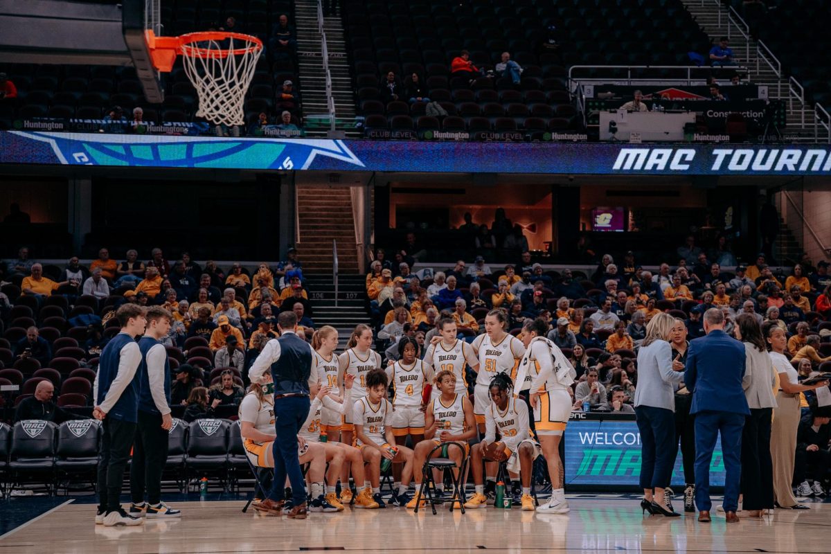 Cleveland, OH - The Toledo Rockets huddle during a timeout at Rocket Arena in Cleveland, Ohio.