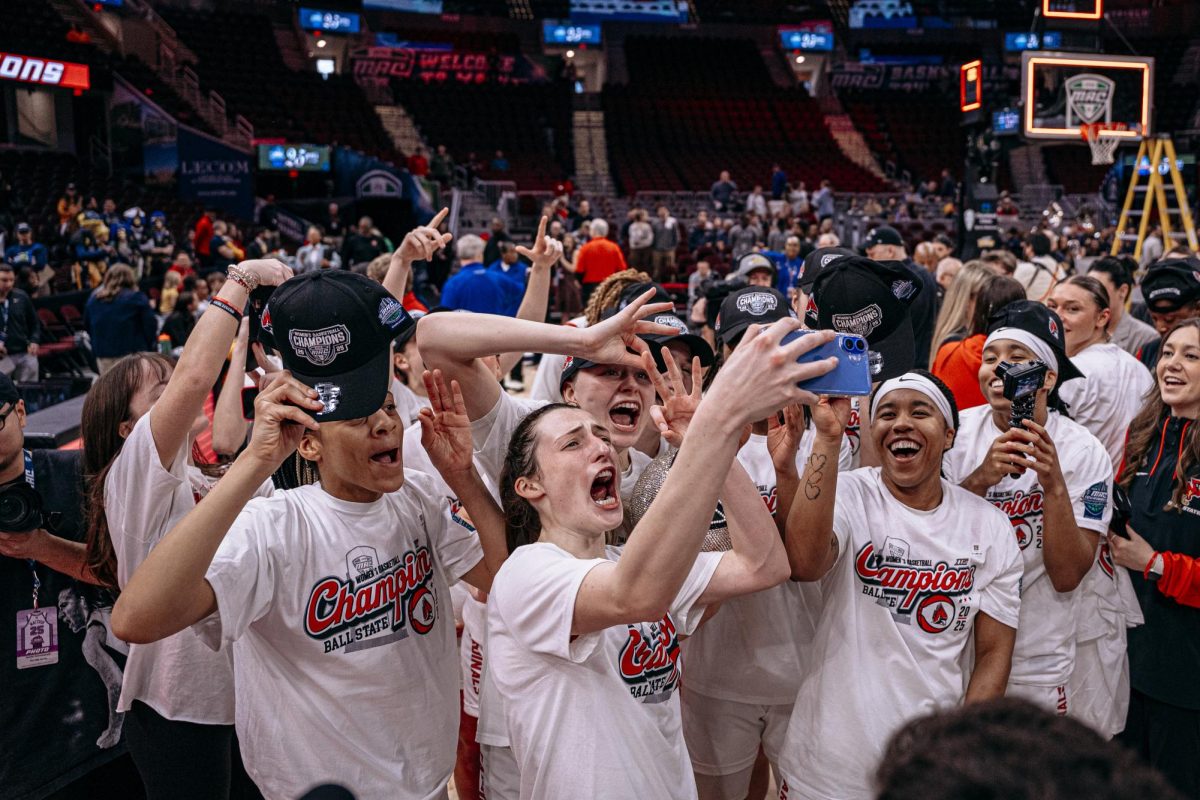 Cleveland, OH - The Cardinals celebrate their championship victory at Rocket Arena in Cleveland, Ohio.