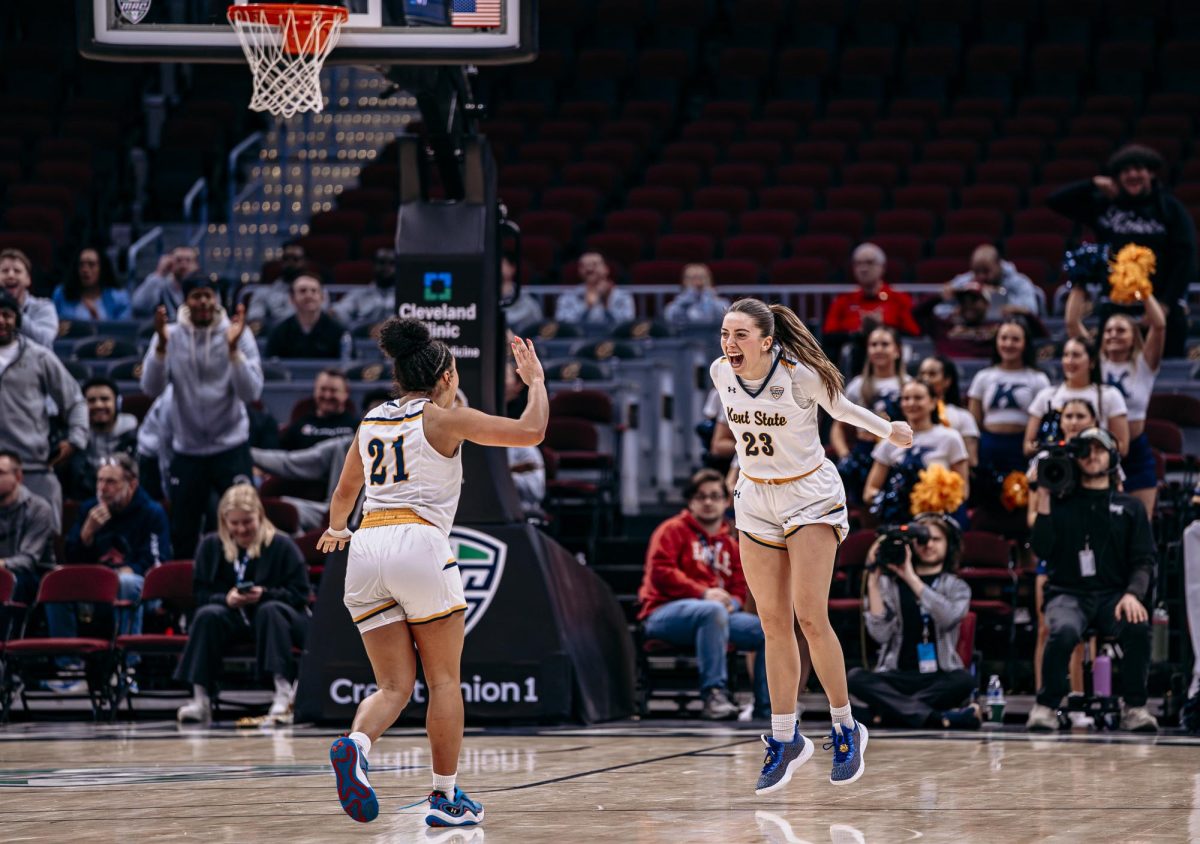 Cleveland, OH - Golden Flashes sophomore guard Mya Babbitt (23) celebrates after scoring a three-pointer resulting in a RedHawk timeout at Rocket Arena in Cleveland, Ohio.