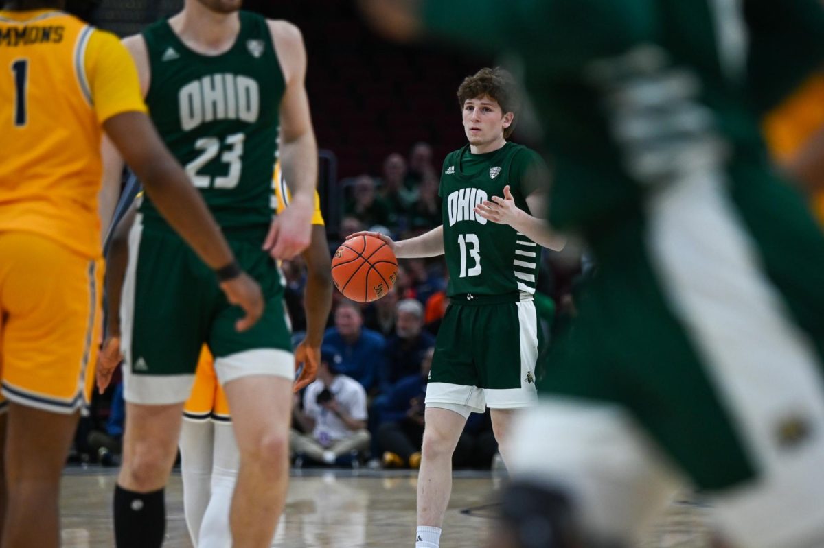 Cleveland, OH - Bobcats junior guard Jackson Paveletzke (13) bringing the ball up at Rocket Arena in Cleveland, Ohio.