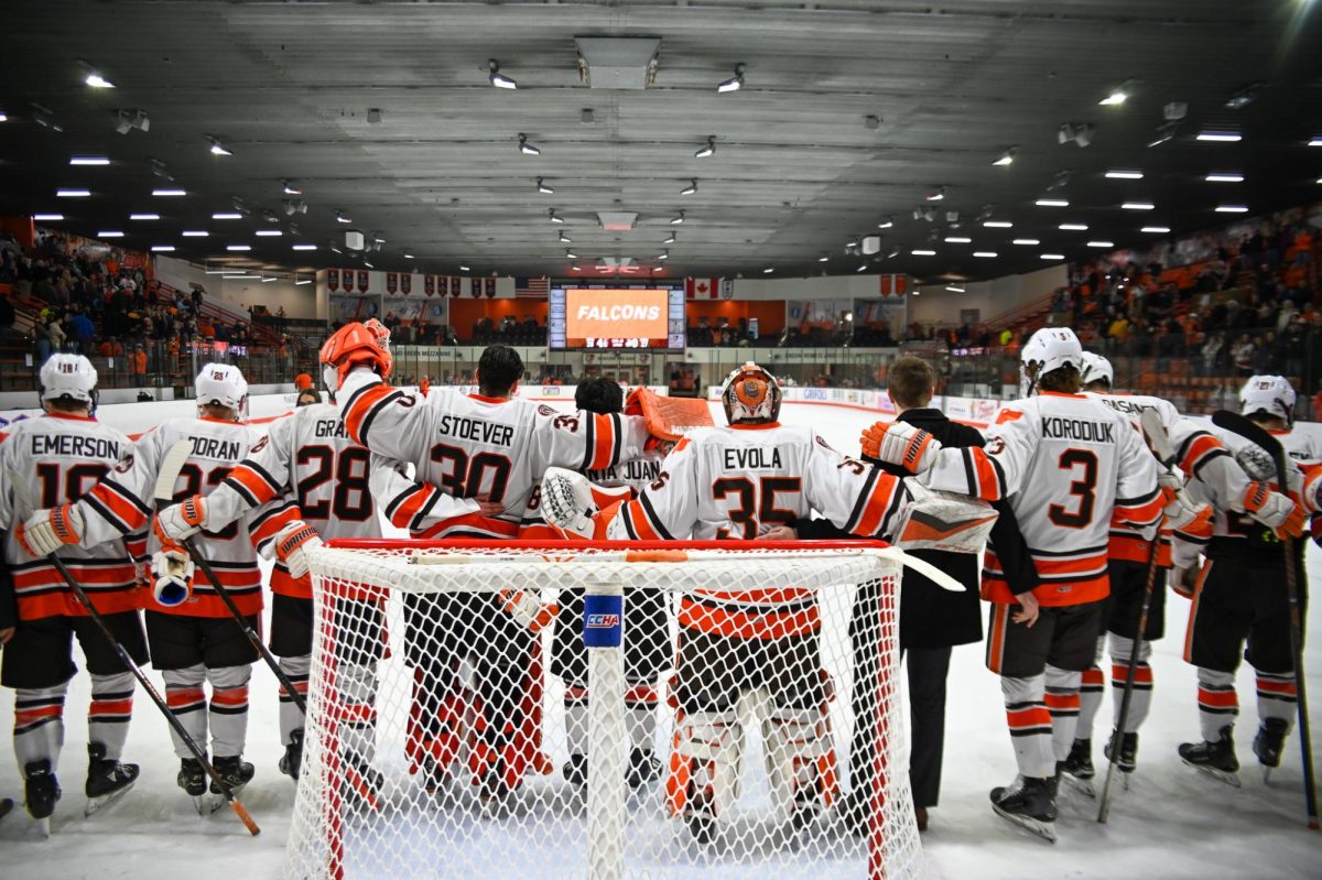 Bowling Green, OH - Falcons line up after the game to sing the Alma Mater as they advance to the next round of the CCHA Playoffs at Slater Family Ice Arena in Bowling Green, Ohio.