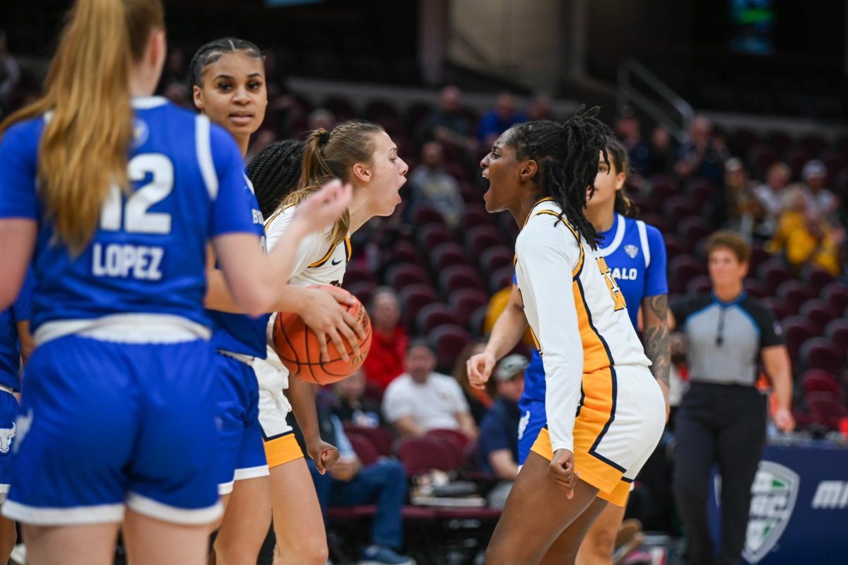 Cleveland, OH - Rockets graduate forward Sammi Mikonowicz (33) and freshman guard Kendall Braden (23) celebrating a foul call at Rocket arena in Cleveland, Ohio.