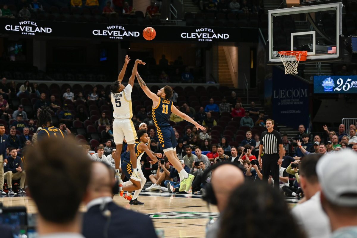 Cleveland, OH - Golden Flashes junior guard Tavari Johnson (6) taking a jumper at the free throw line at Rocket Arena in Cleveland, Ohio.