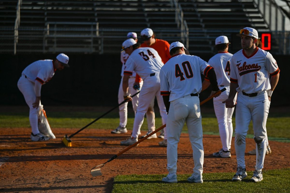 Members of BGSU's baseball team upkeep their own field.