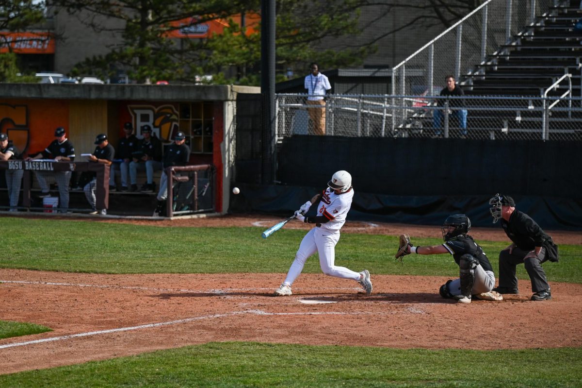 Bowling Green, OH - Falcons junior infielder Sam Seidel (21) sending a hit deep to the outfield at Steller Field in Bowling Green, Ohio.