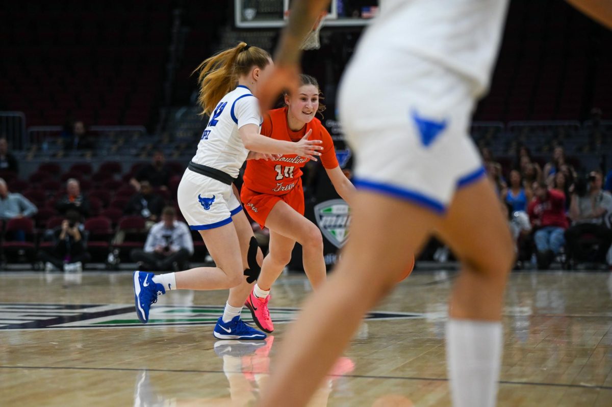 Cleveland, OH - Falcons sophomore guard Paige Kohler (10) driving around the Bulls defense at Rocket Arena in Cleveland, Ohio.