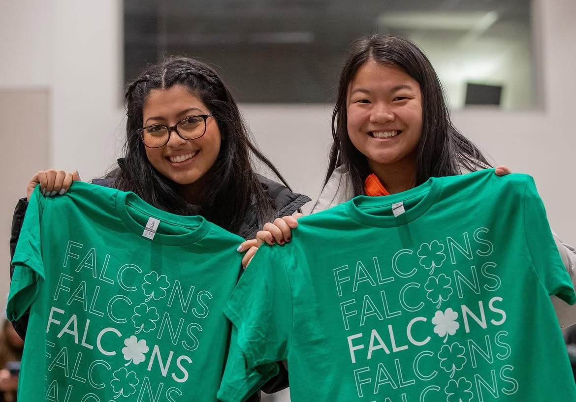 Students show off their free t-shirts from the Shamrock Social (photo via Official BGSU's Instagram).