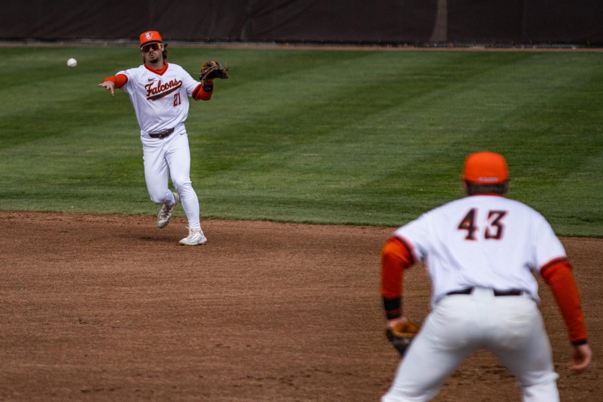 Bowling Green, OH- Falcons junior second-baseman Sam Seidel (21) throws the ball to sophomore first-baseman Brady Birchmeier (41) for an out at Stellar Field in Bowling Green, Ohio.