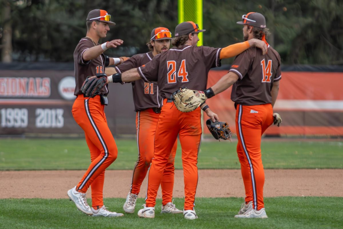 Bowling Green, OH- Falcons infielders gather behind the mound after taking down the Flyers 11-9 at Steller Field in Bowling Green, Ohio.