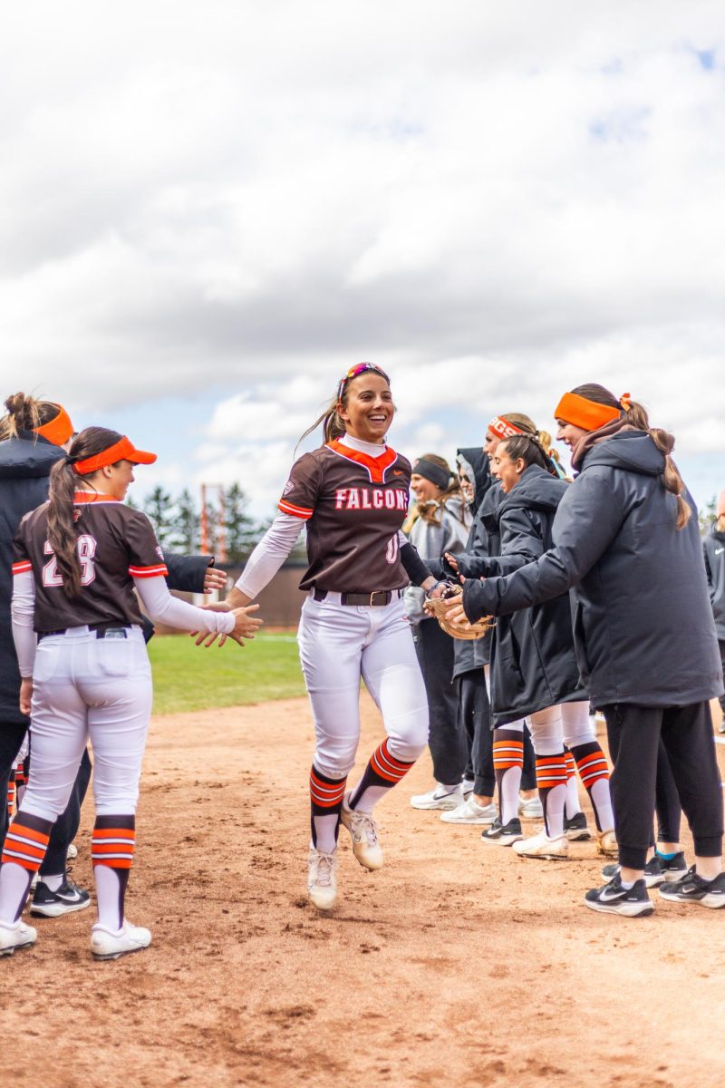 Bowling Green, OH- Falcons redshirt freshman shortstop Addie Martin (0) high-fives her team during introductions at Meserve Field in Bowling Green, Ohio.