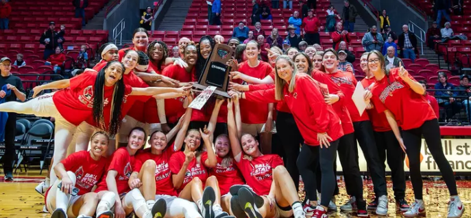 Ball State taking a picture with their regular season MAC trophy